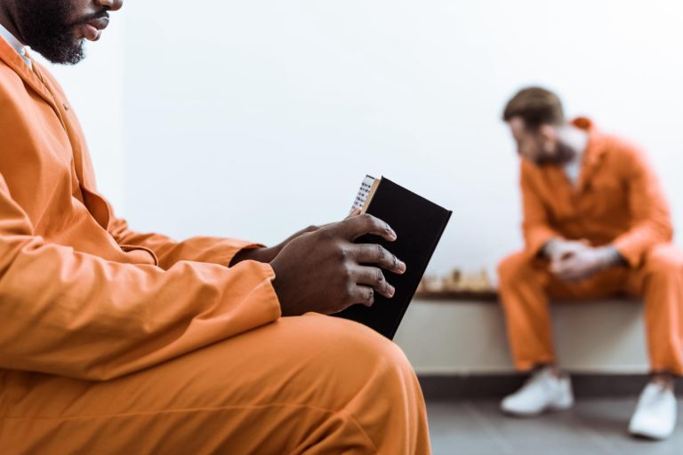 Inmate reading a book - Double Literacy