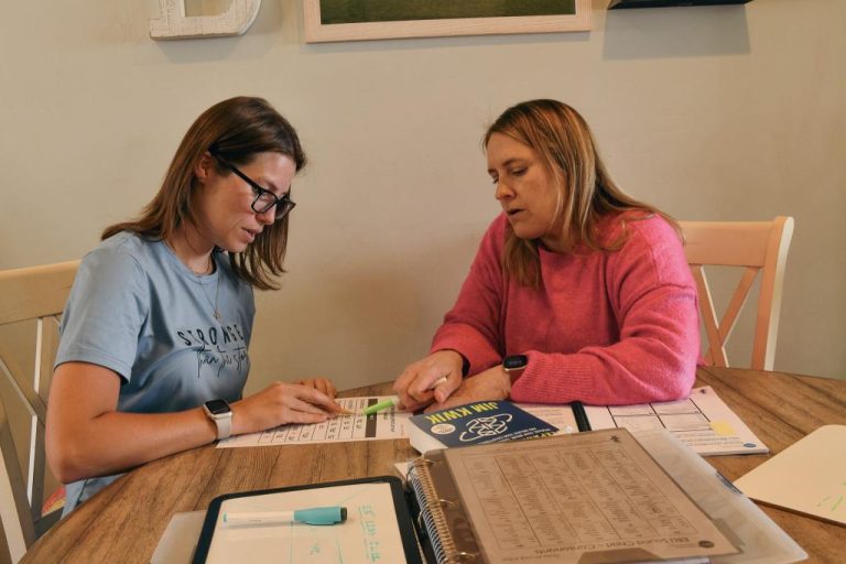 Sponsor teaching a woman how to read. Double Literacy organization sponsored.